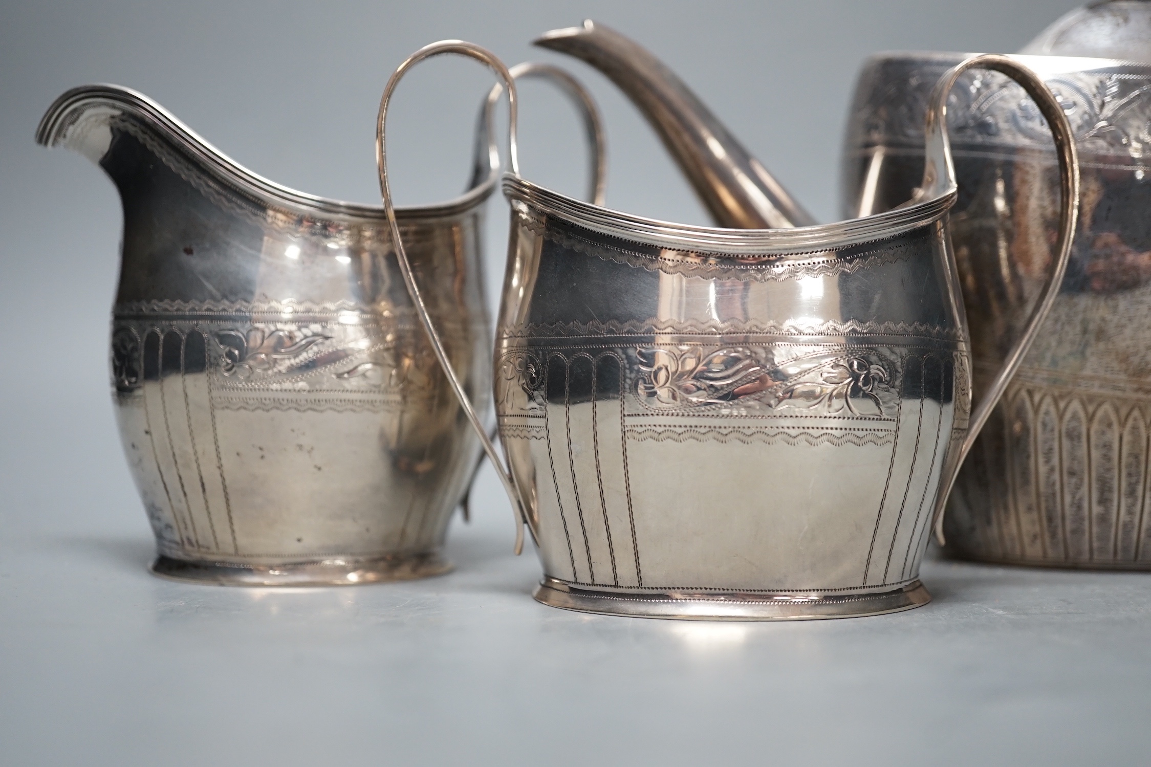 A 1930's engraved silver oval three piece tea set, S. Blanckensee & Sons Ltd, Chester, 1936/7, gross weight 26.5oz.